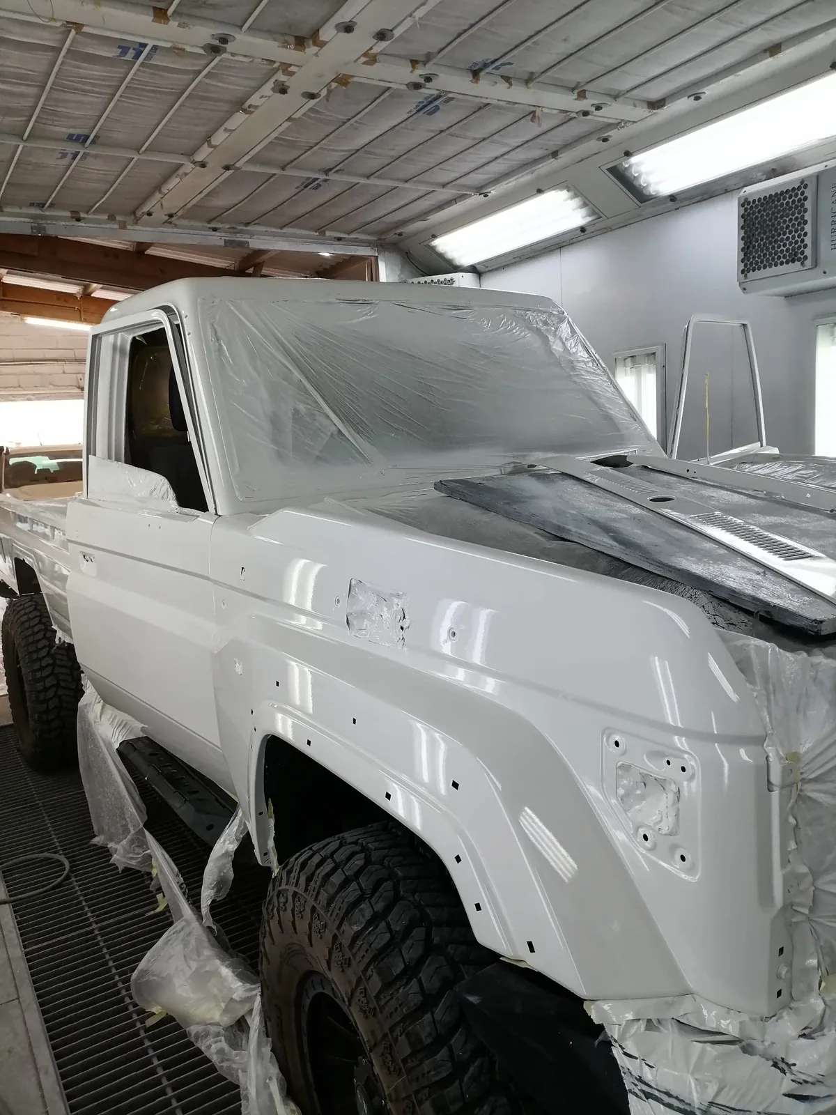 4x4 masked in plastic and prepared for paint in the spray booth